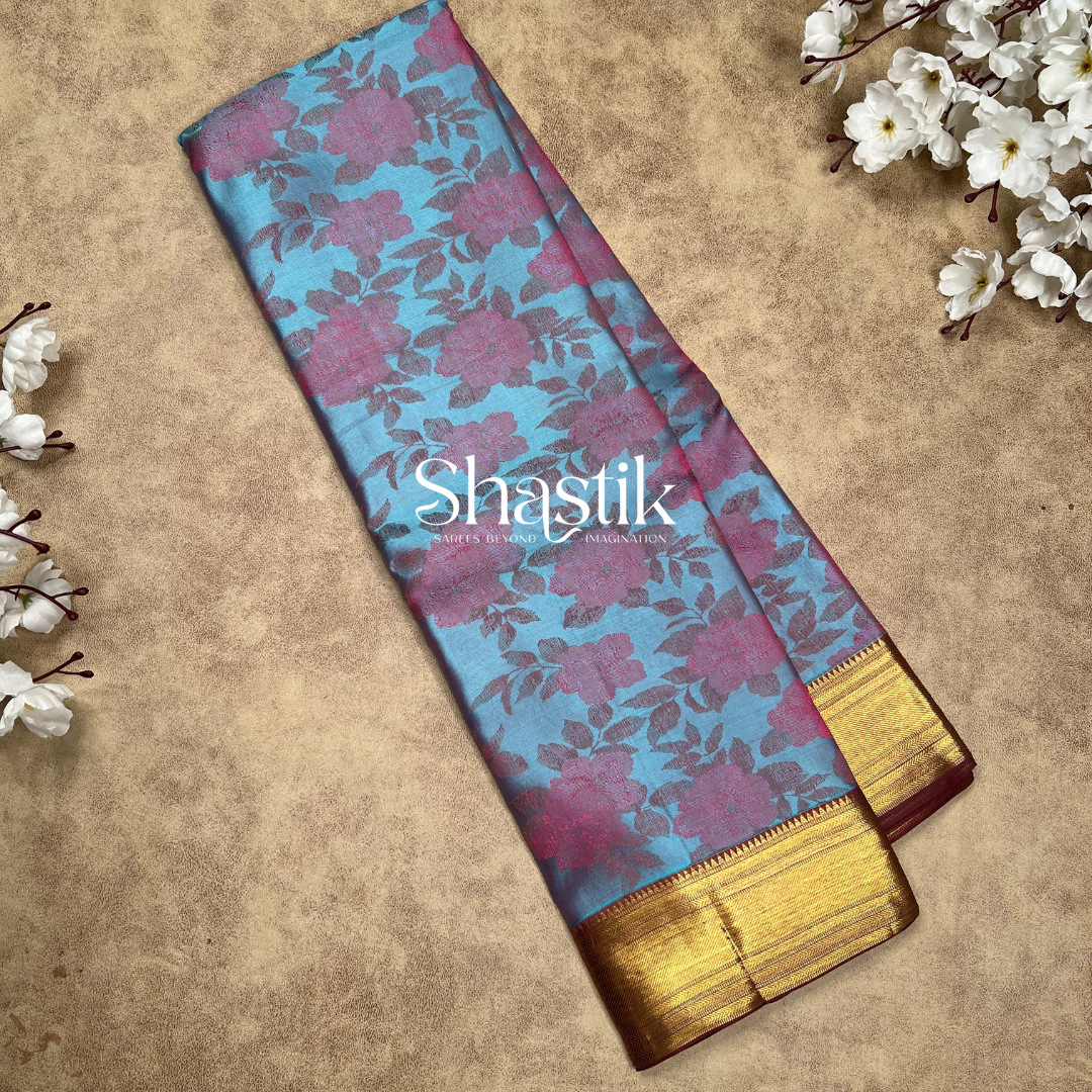 Contemporary blue saree with golden zari design